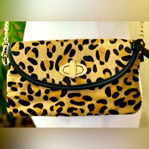 Leopard print Clarks purse with gold hardware.